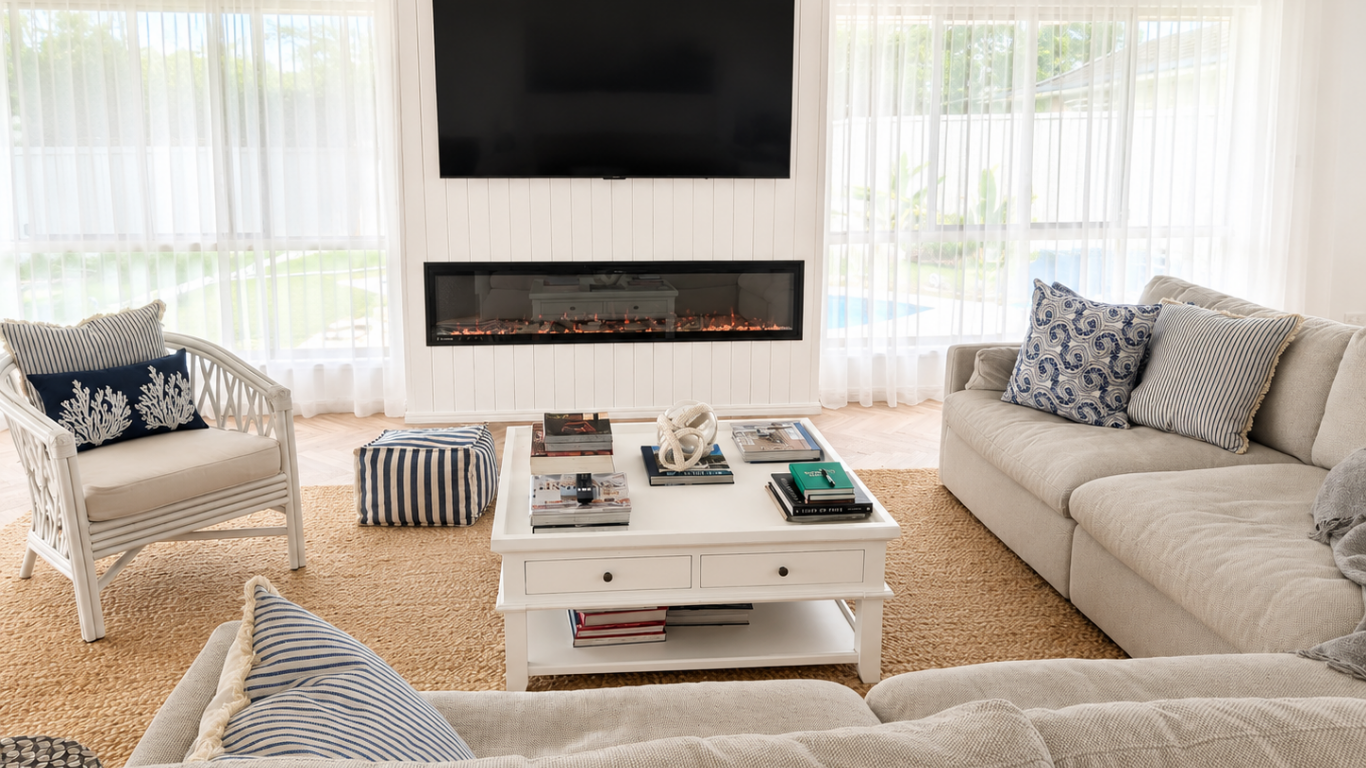 Interior decorator arranging blue and white accessories during a home consultation
