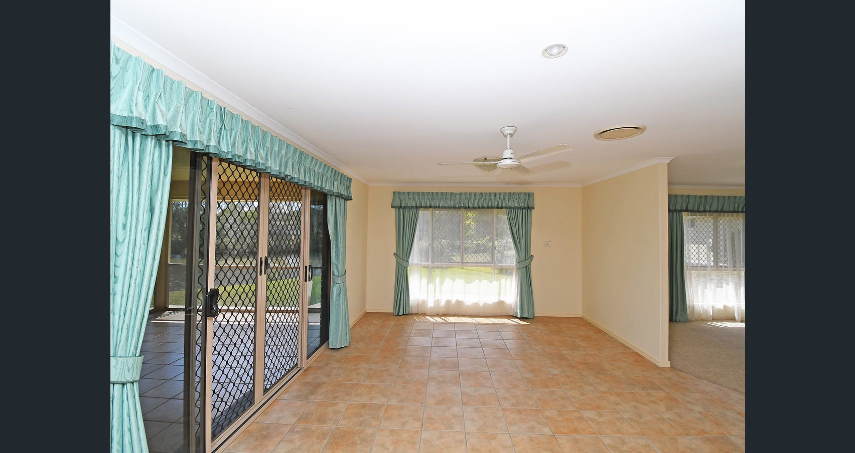 Open-plan living area before the Urangan transformation